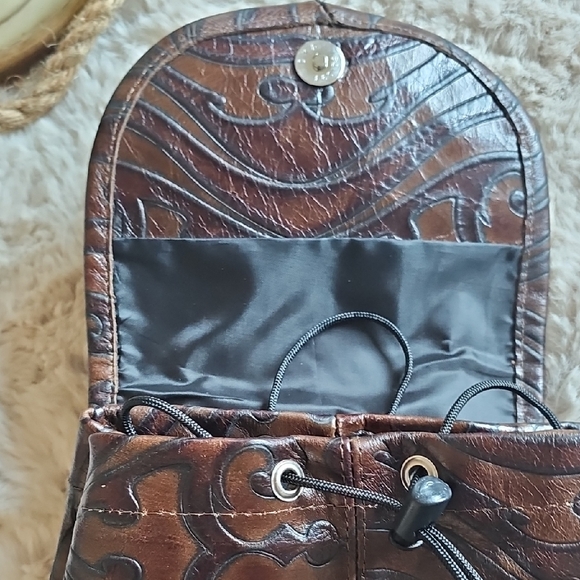 Elegant Brown Leather Backpack with Embossed Design - Picture 13 of 14